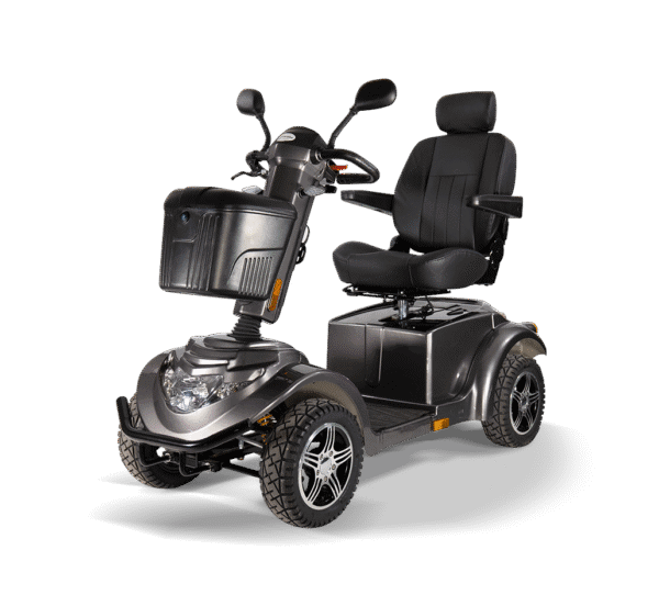 Scooterpac Ignite Mini mobility scooter three-quarter view showing gray finish, padded seat, and rugged tires