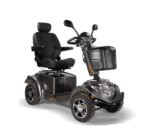 Scooterpac Ignite Mini mobility scooter three-quarter view showing black seat, suspension, and front basket