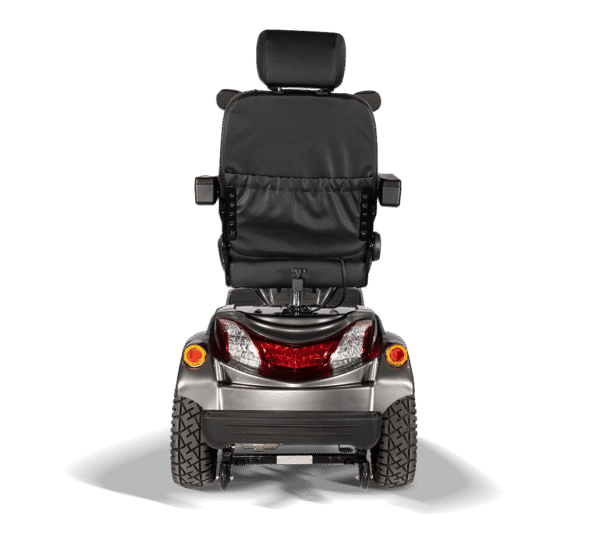 Scooterpac Ignite Mini mobility scooter rear view showing taillights, suspension and all-terrain tires