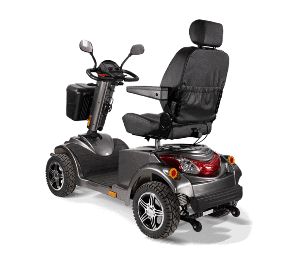 Scooterpac Ignite Mini mobility scooter rear three-quarter view showing heated seat, suspension, and alloy wheels