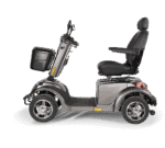Scooterpac Ignite Mini mobility scooter side view showing silver gray body, black seat, basket, and alloy wheels