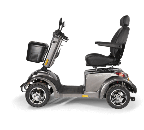 Scooterpac Ignite Mini mobility scooter side view showing silver gray body, black seat, basket, and alloy wheels