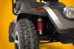Scooterpac Savvy 8 Plus mobility scooter wheel and red suspension detail view
