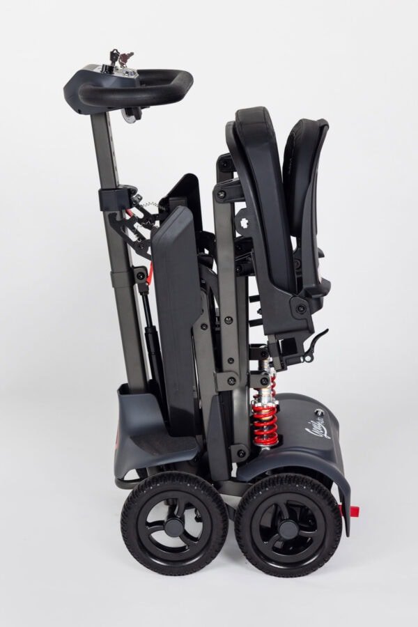 Monarch Genie mobility scooter folded side view showing compact design and wheels