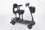 Monarch Genie ultralight mobility scooter in gray, side view with front basket and padded seat