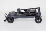 Monarch Genie ultralight mobility scooter folded side view showing compact design and large wheels