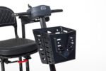 Monarch Genie mobility scooter detail view showing black folding storage basket attachment