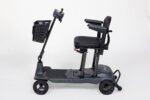Monarch Genie Ultralight Mobility Scooter side view showing black frame, seat, and basket