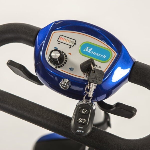 Monarch Smarti mobility scooter control panel detail showing blue dashboard with battery indicator and key fob