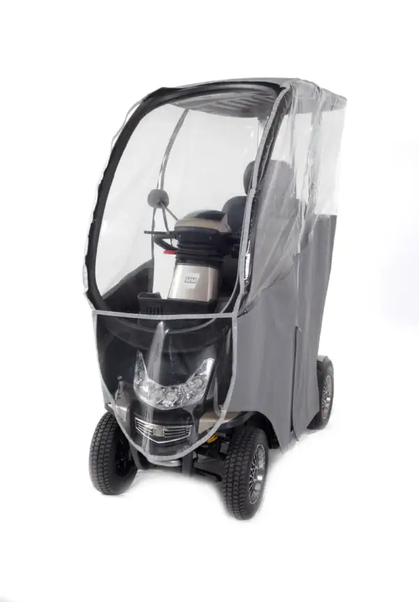 Storm+ Class 3 mobility scooter with clear hard canopy, front three-quarter view showing enclosed cabin