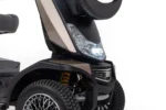 Storm+ mobility scooter front detail view showing LED headlight and suspension system