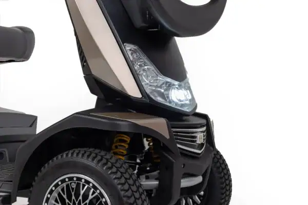 Storm+ mobility scooter front detail view showing LED headlight and suspension system