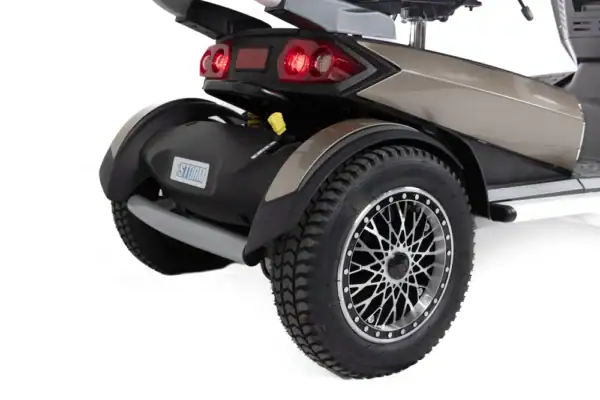 Storm+ mobility scooter rear wheel detail showing spoke design and LED taillights