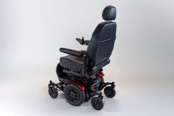 Monarch Super Powerchair in black leather, three-quarter rear view showing adjustable headrest and seat positioning