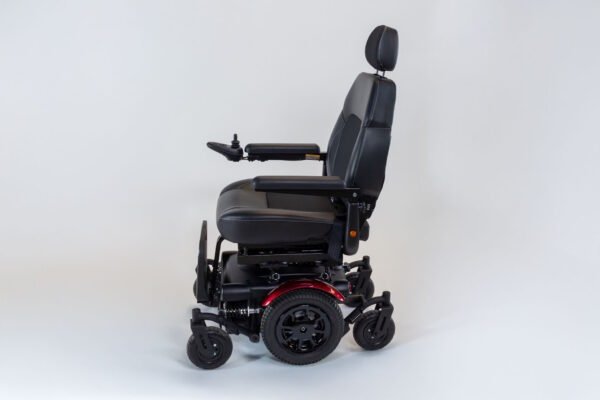 Monarch Super Powerchair side profile view showing black leather seat, headrest, and joystick control