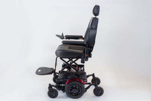 Monarch Super Powerchair side profile view showing black leather seat, joystick control, and 6-wheel base
