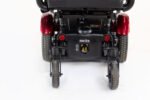 Merits Monarch Super Powerchair rear view showing red fenders, anti-tip wheels and suspension system