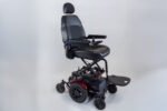 Monarch Super Powerchair side view showing elevated seat, black leather upholstery and rugged wheels