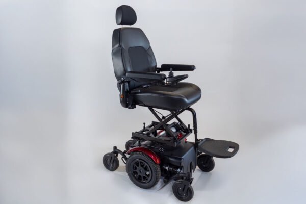 Monarch Super Powerchair side view showing elevated seat, black leather upholstery and rugged wheels