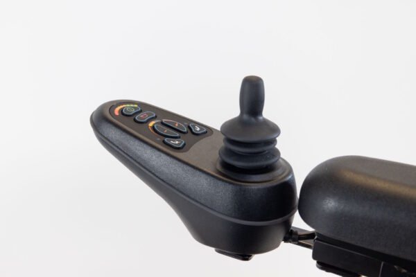 Monarch Super Powerchair joystick controller detail view showing black control panel with illuminated buttons