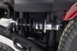 Monarch Super Powerchair rear shock absorber detail view showing spring suspension system