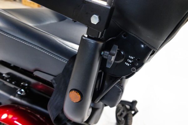Monarch Super Powerchair seat angle adjustment mechanism with 135°, 120°, 105° markings and orange reflector detail