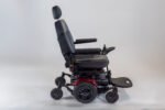 Monarch Super Powerchair black electric wheelchair side profile view with headrest and armrests
