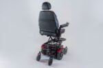 Monarch Super Powerchair shown from rear three-quarter angle with black seat and red tail lights
