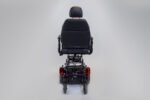 Monarch Super Powerchair rear view showing black seat, red taillights, and sturdy base frame