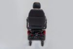 Monarch Super Powerchair rear view showing black seat, red taillights, and sturdy wheel base